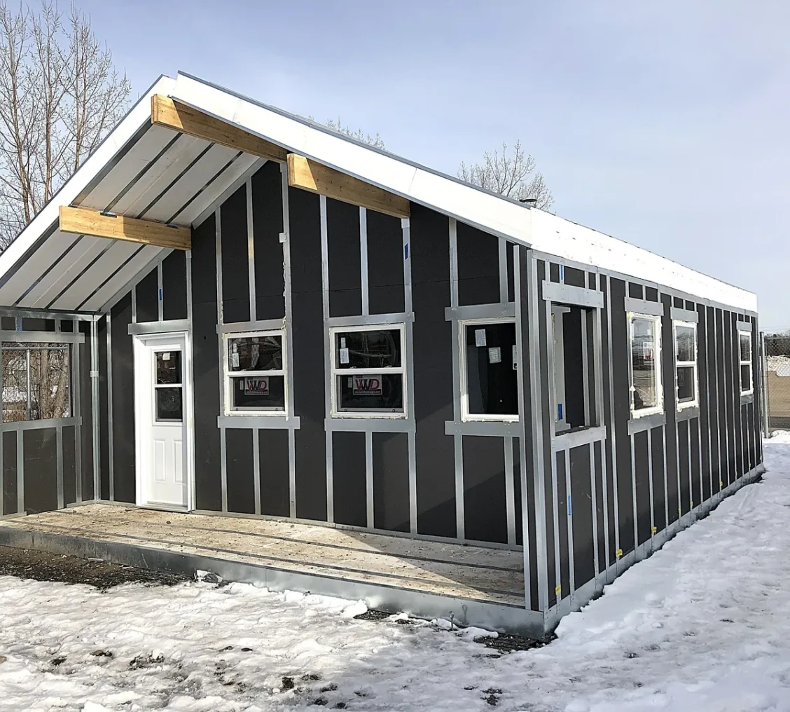 Unfinished building on snowy ground